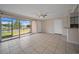 Spacious living room with a sliding glass door and tile flooring, perfect for entertaining and relaxation at 614 Orange Dr # 196, Altamonte Springs, FL 32701