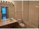 Bathroom view includes a vanity, toilet, mirror and a shower-tub combo at 6214 Stevenson Dr # 208, Orlando, FL 32835