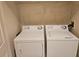 Laundry area features standard side by side washer and dryer units at 6214 Stevenson Dr # 208, Orlando, FL 32835