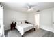 Bright bedroom featuring a cozy bed, white linens, natural light, and neutral decor at 630 Park Valley Cir, Minneola, FL 34715