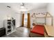 Charming ' bedroom with unique bed frame, modern closet and wood-look flooring at 630 Park Valley Cir, Minneola, FL 34715