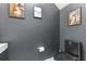 Contemporary bathroom with a sleek toilet and modern, artistic decor at 6388 Castelven Dr # 102, Orlando, FL 32835