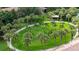 Community featuring lush landscaping, mature trees, and walking path at 6388 Castelven Dr # 102, Orlando, FL 32835
