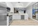 Updated kitchen featuring a stylish mirror and stainless steel appliances at 6388 Castelven Dr # 102, Orlando, FL 32835