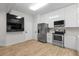 Spacious kitchen featuring stainless steel appliances, and ample cabinet space at 6388 Castelven Dr # 102, Orlando, FL 32835
