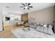 Spacious living area with open-concept design, seamlessly flowing into the dining and kitchen spaces at 6388 Castelven Dr # 102, Orlando, FL 32835