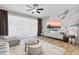 Bright and stylish living room featuring a unique marble accent wall and modern furnishings at 6388 Castelven Dr # 102, Orlando, FL 32835