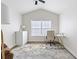 Well-lit home office with vaulted ceilings, hardwood floors, a large window, and modern furniture at 6388 Castelven Dr # 102, Orlando, FL 32835