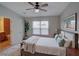 Well-decorated bedroom with a ceiling fan, area rug, and en-suite bathroom at 7462 Bentonshire Ave, Windermere, FL 34786