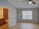 Well-lit bedroom featuring tile flooring, neutral walls, and access to en-suite bathroom at 7462 Bentonshire Ave, Windermere, FL 34786