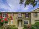 Charming townhome featuring red shutters, a well manicured front yard, and a welcoming entrance at 7462 Bentonshire Ave, Windermere, FL 34786