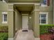 Close up of the front door, showcasing the entryway and landscaping at 7462 Bentonshire Ave, Windermere, FL 34786