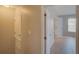 Hallway featuring neutral walls, tile flooring, and a door leading to a bedroom at 7462 Bentonshire Ave, Windermere, FL 34786