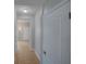 Hallway offers tiled flooring and access to various rooms enhancing the home's layout and flow at 7462 Bentonshire Ave, Windermere, FL 34786