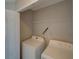 A well-equipped laundry room features a washer and a dryer at 7462 Bentonshire Ave, Windermere, FL 34786
