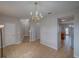 Open living space offering stairs, tile floors, a chandelier, and an archway at 7462 Bentonshire Ave, Windermere, FL 34786