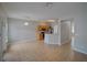 Bright open-concept living room and kitchen featuring tile floors and stainless steel appliances at 7462 Bentonshire Ave, Windermere, FL 34786
