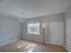 Bright living room featuring tile floors, a chandelier, and lots of natural light at 7462 Bentonshire Ave, Windermere, FL 34786