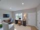 Living room with neutral walls, bright light, and multiple workstations at 7462 Bentonshire Ave, Windermere, FL 34786