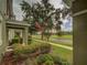 Green lawn and tropical trees on a quiet neighborhood street at 7462 Bentonshire Ave, Windermere, FL 34786
