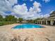 Sparkling community pool with spacious sun deck and comfortable lounge area at 7462 Bentonshire Ave, Windermere, FL 34786