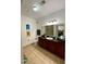 Bathroom featuring a vanity with dark wood cabinets, and a toilet at 8010 Tuscany Way # 3102, Davenport, FL 33896