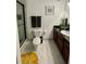 Bathroom featuring a glass shower enclosure, toilet, and vanity with dark wood cabinets at 8010 Tuscany Way # 3102, Davenport, FL 33896