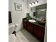 Bathroom with a vanity, granite countertop, and an undermount sink at 8010 Tuscany Way # 3102, Davenport, FL 33896