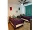 Cozy bedroom featuring two twin beds, decorative wall hangings, and a ceiling fan at 8010 Tuscany Way # 3102, Davenport, FL 33896