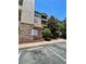 Exterior view of the condo building showcasing well-maintained landscaping and architectural details at 8010 Tuscany Way # 3102, Davenport, FL 33896