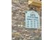 Close up of the building sign listing units and address on a stone wall at 8010 Tuscany Way # 3102, Davenport, FL 33896