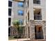Exterior of home featuring stone accents, private balconies, and a well-maintained entryway at 8010 Tuscany Way # 3102, Davenport, FL 33896