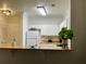 Kitchen with white cabinets, granite countertops, white appliances, and modern lighting at 8010 Tuscany Way # 3102, Davenport, FL 33896