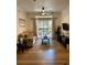 Living room with a patio, a sofa, hardwood floors, and black furniture at 8010 Tuscany Way # 3102, Davenport, FL 33896