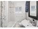 All white bathroom, including a tub, shower, toilet and sink at 815 E 11Th Ave, Mount Dora, FL 32757