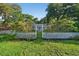 Charming single-story home with a bright blue front door and picket fence at 815 E 11Th Ave, Mount Dora, FL 32757