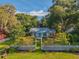 Charming single Gathering home with lush front lawn and well-maintained garden at 815 E 11Th Ave, Mount Dora, FL 32757