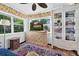 Bright living room featuring a decorative cabinet, display shelving and a colorful oriental rug at 815 E 11Th Ave, Mount Dora, FL 32757
