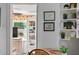 Cozy living room view featuring built-in shelves with decor and a glimpse into an adjacent sitting area at 815 E 11Th Ave, Mount Dora, FL 32757