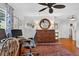 Bright office space with hardwood floors, ceiling fan, and neutral wall color at 815 E 11Th Ave, Mount Dora, FL 32757