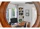 Bright office space with hardwood floors, ceiling fan, and built in shelving at 815 E 11Th Ave, Mount Dora, FL 32757