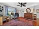 Bright office space with hardwood floors, ceiling fan, and neutral wall color at 815 E 11Th Ave, Mount Dora, FL 32757
