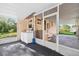 Image showcases screened-in porch area equipped with washer, dryer, and ample outdoor space at 815 E 11Th Ave, Mount Dora, FL 32757