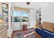 Comfortable sitting area featuring a bookcase and a bright view of the yard at 815 E 11Th Ave, Mount Dora, FL 32757