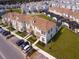 Bird's-eye view of townhomes with private pools and modern architecture in a well-planned community at 8934 Stinger Dr, Davenport, FL 33896