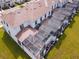 Townhome aerial view showcases backyard pools and modern screened in patios for privacy at 8934 Stinger Dr, Davenport, FL 33896