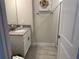 Clean single sink bathroom with a shower and gray flooring at 8934 Stinger Dr, Davenport, FL 33896