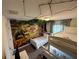 Nicely decorated bedroom featuring custom safari wall art, bunkbeds and a twin bed at 8934 Stinger Dr, Davenport, FL 33896