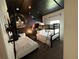 Whimsical space-themed bedroom with bunk beds and creative wall art, perfect for  at 8934 Stinger Dr, Davenport, FL 33896