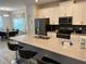 Contemporary kitchen featuring a large island with breakfast bar and modern appliances at 8934 Stinger Dr, Davenport, FL 33896